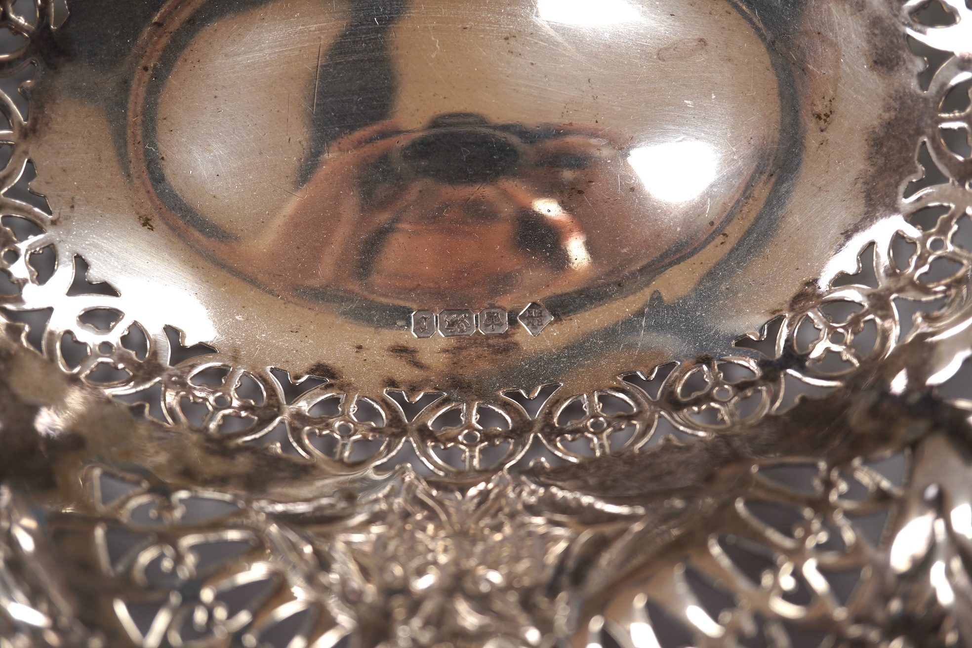 A late Victorian repousse silver oval bonbon dish, Martin, Hall & Co, Sheffield, 1895, length 20.8cm, together with an Elizabeth II pieced silver pedestal bonbon dish by Asprey & Co Ltd, London, 1965, 10.8oz.